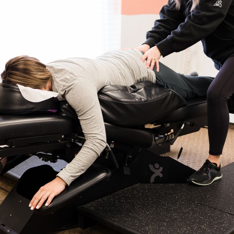 pregnant woman on chiropractor table getting Webster technique